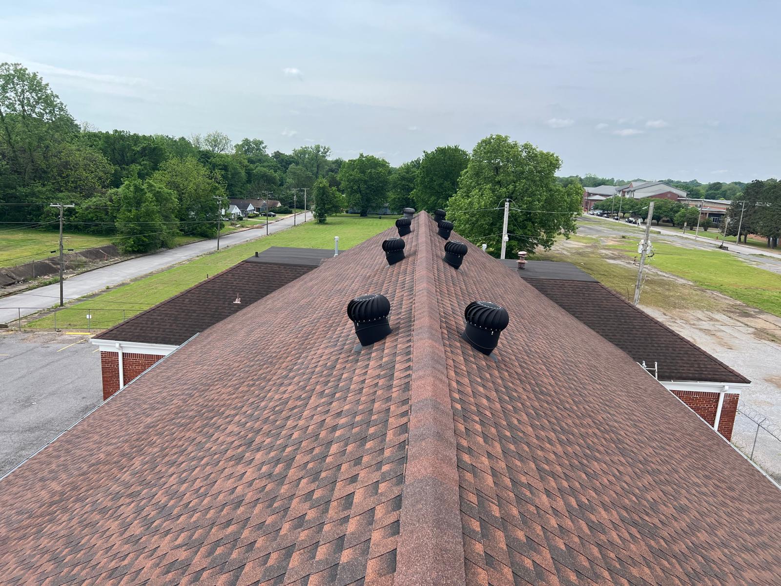 Commercial shingle roof with ridge vents